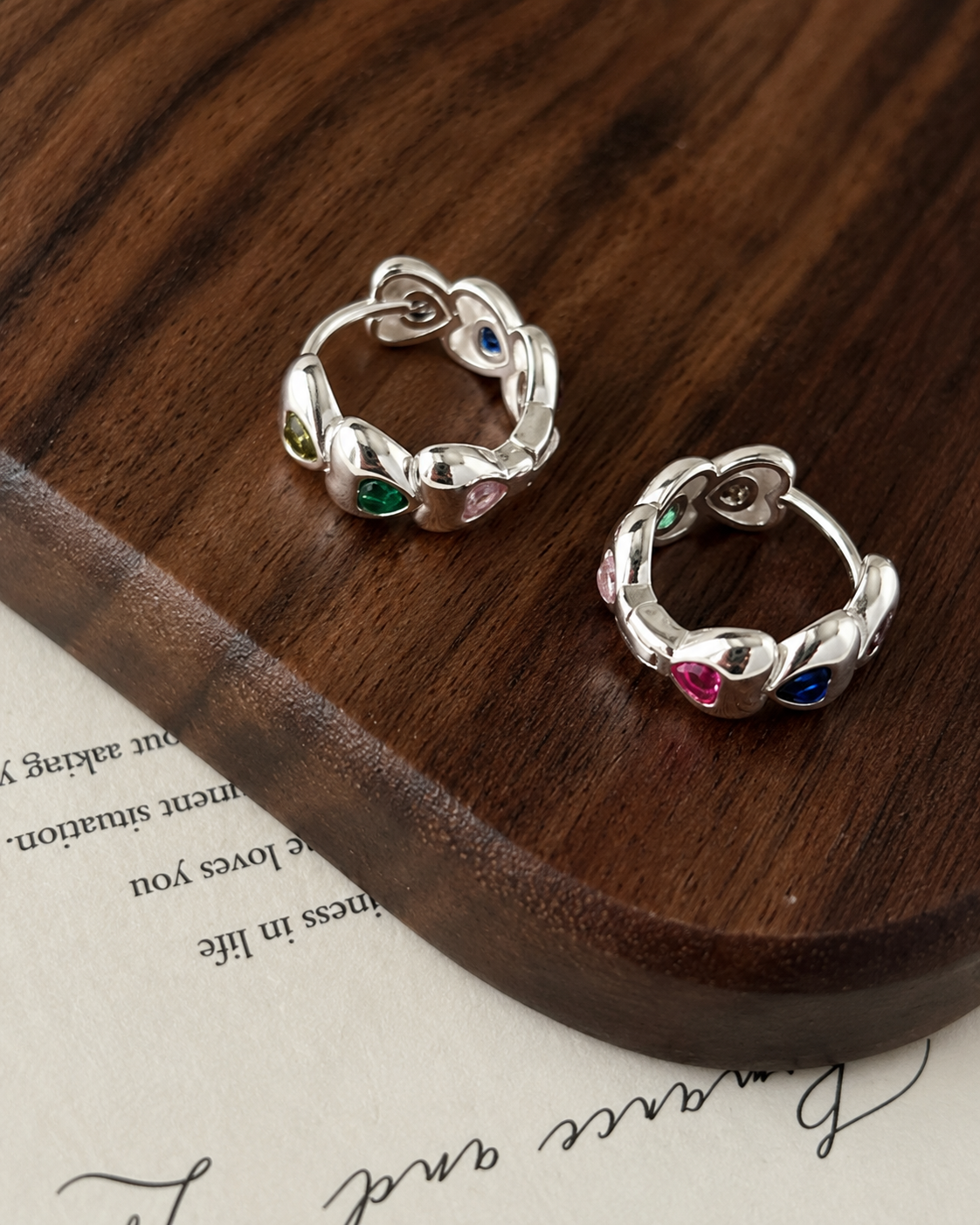 Heart-shaped earrings made of colored zircon